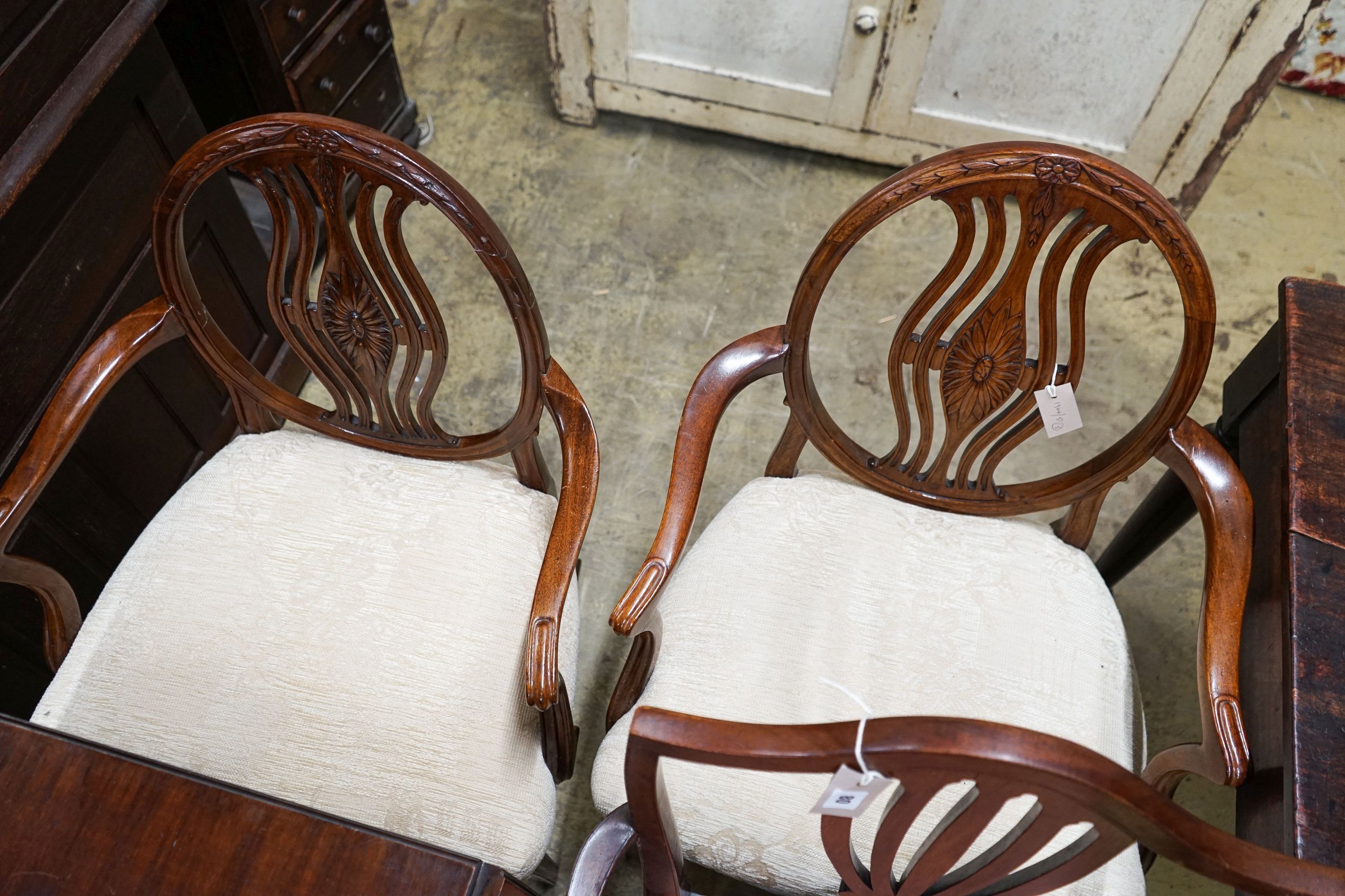 A pair of Hepplewhite style elbow chairs with oval backs, one other chair and a bedside commode cabinet (4)